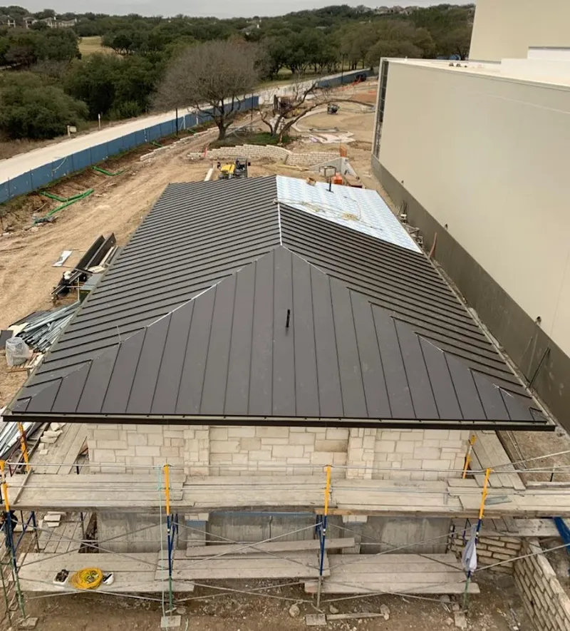 Metal roof new construction with scaffolding in Wayne